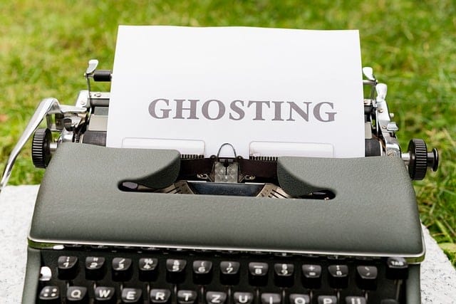 typewriter with 'ghosting' types on paper