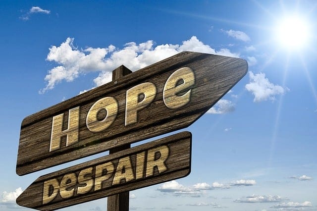 signpost for hope and, opposite direction, despair